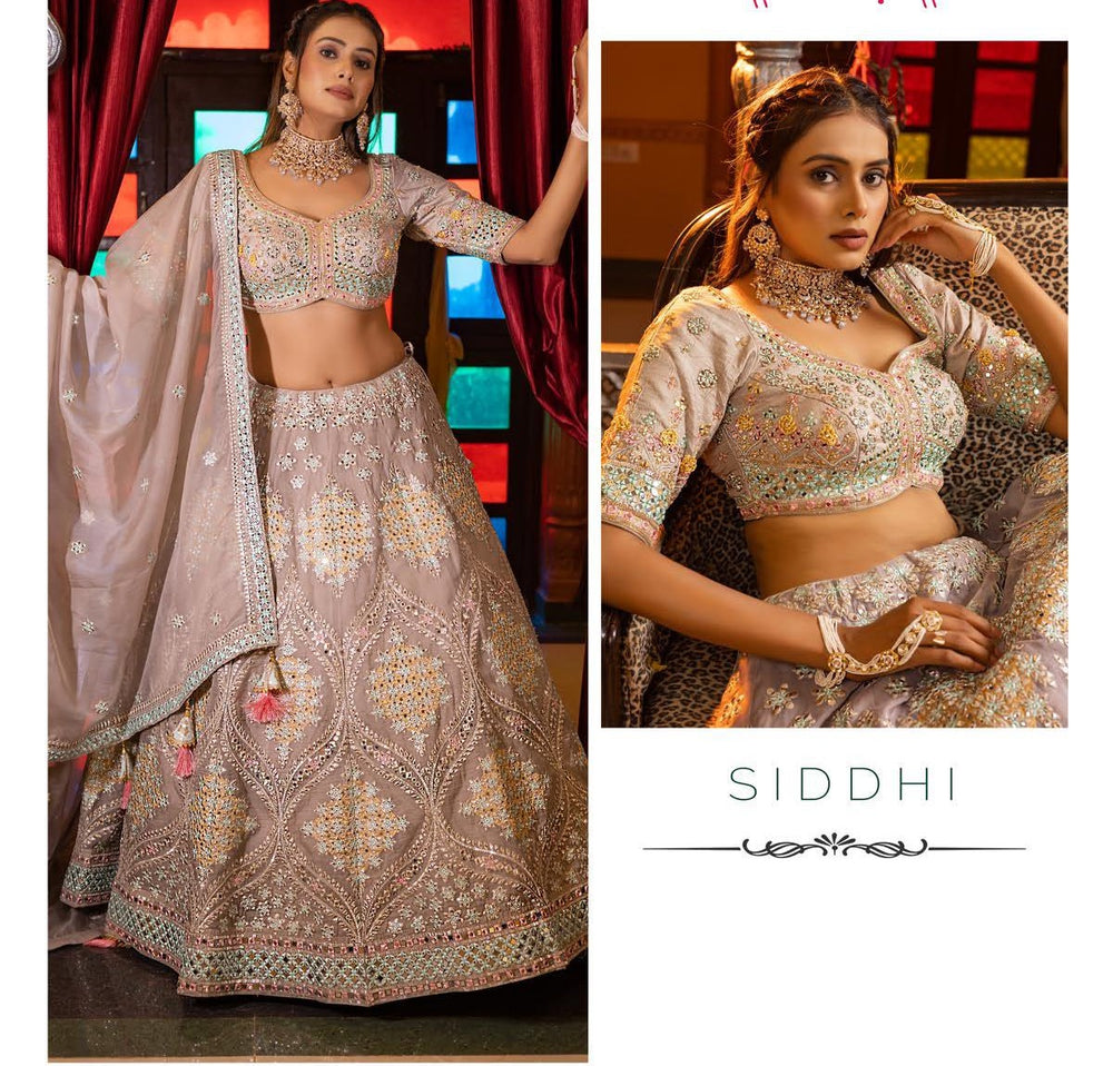 Designed for those who love elegance, this blush mauve silk lehenga choli features stunning embroidery, perfect for weddings and festive occasions