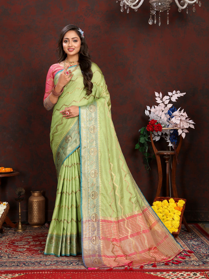 Luxurious pista-green Katan silk saree with intricate zari work, perfect for bridal events.