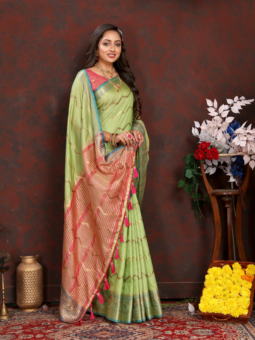 Pista-green Katan silk saree with exquisite zari work, ideal for formal celebrations.