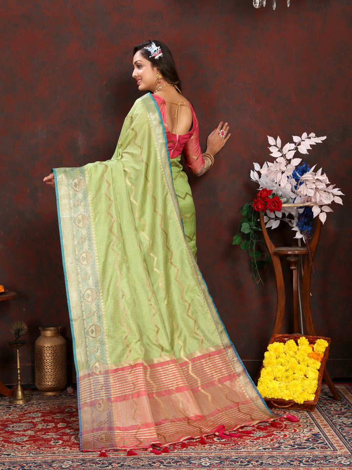 Elegant pista-green silk saree with delicate zari work, perfect for weddings and special occasions.