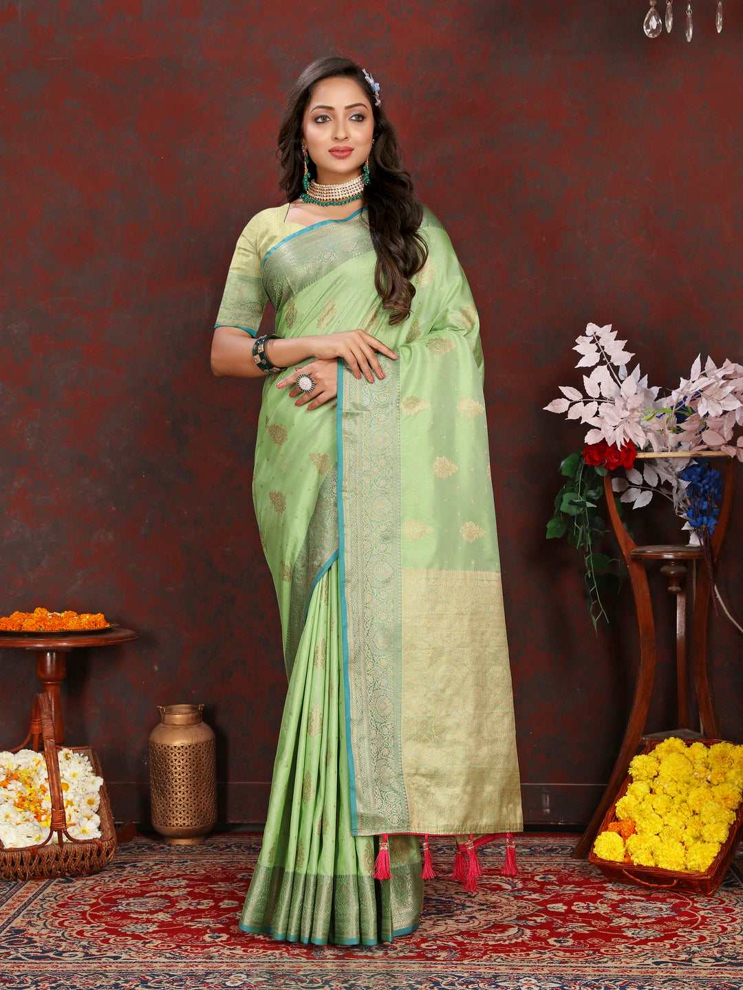 Elegant pista green Katan silk saree with graceful zari-adorned pallu, perfect for traditional celebrations.