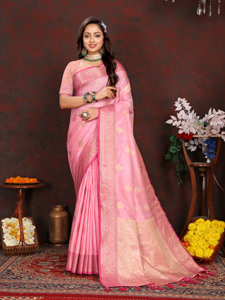 Stunning pink soft Katan silk saree with delicate zari-adorned pallu, ideal for festive celebrations.