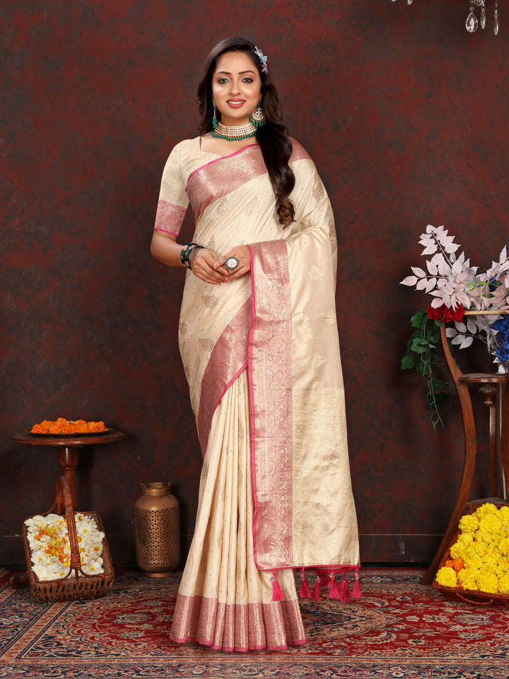 Elegant cream Katan silk saree with graceful zari-adorned pallu, perfect for traditional weddings and celebrations.