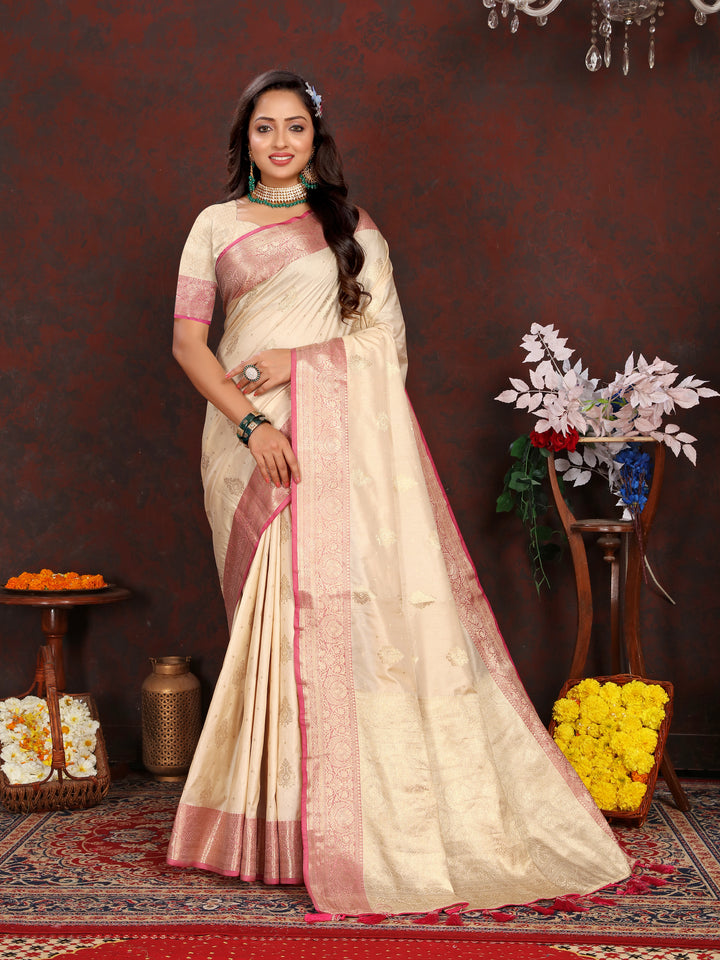 Stunning cream soft Katan silk saree featuring intricate zari work on the pallu, ideal for festive occasions.