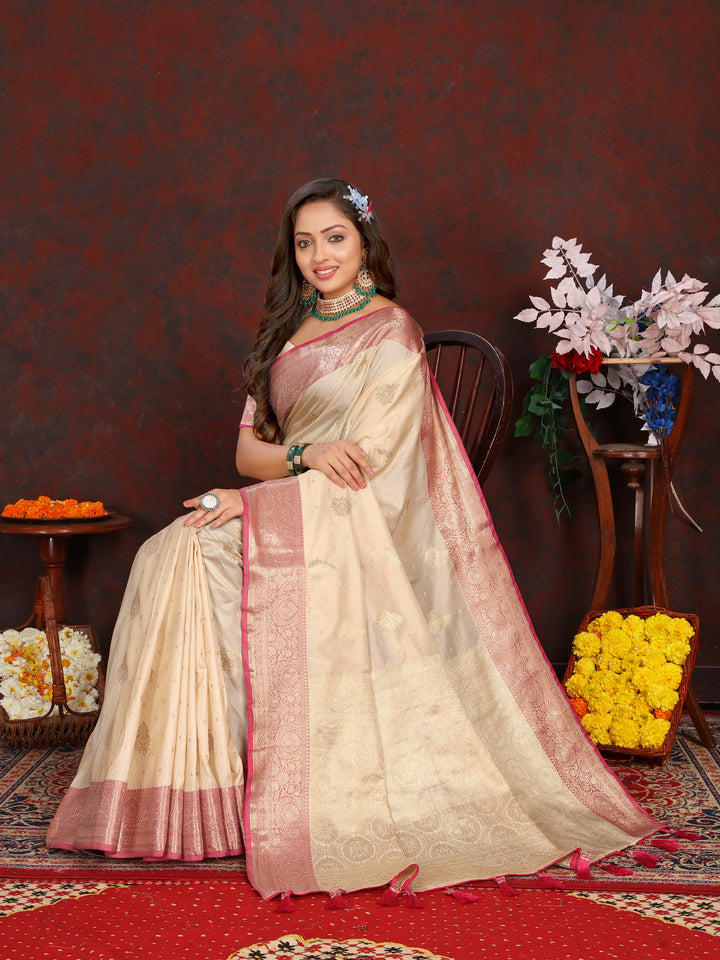 Timeless cream Katan silk saree with delicate zari detailing on the pallu, perfect for cultural gatherings.