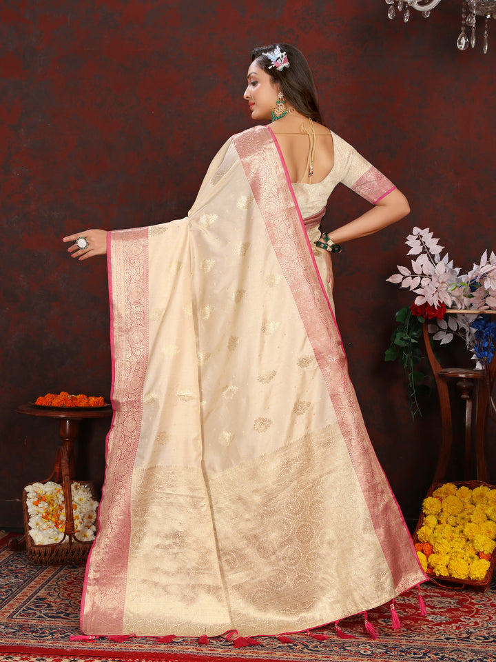 Graceful cream soft Katan silk saree with exquisite zari-adorned pallu, perfect for weddings and celebrations.