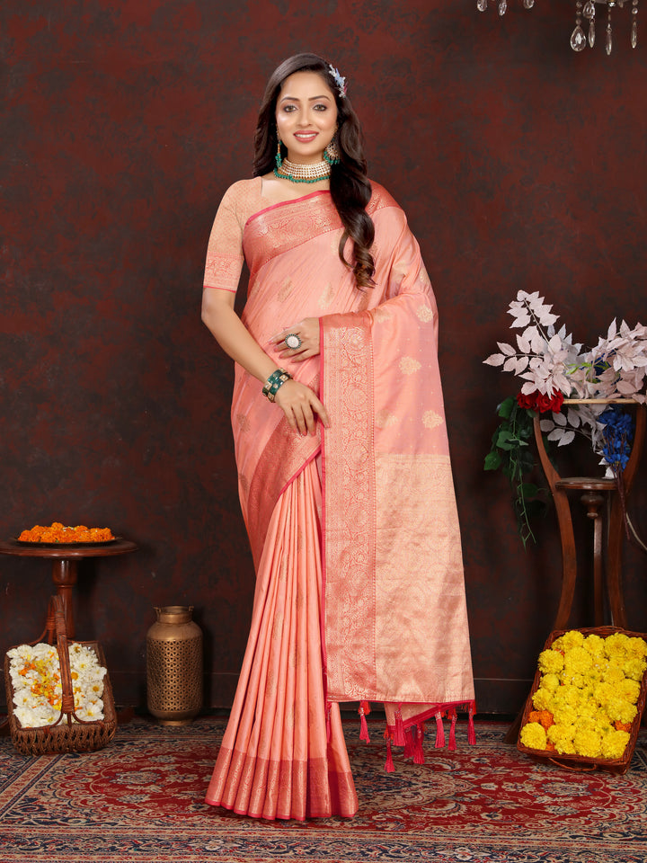 Beautiful peach Katan silk saree with graceful zari-adorned pallu, perfect for traditional events and weddings.