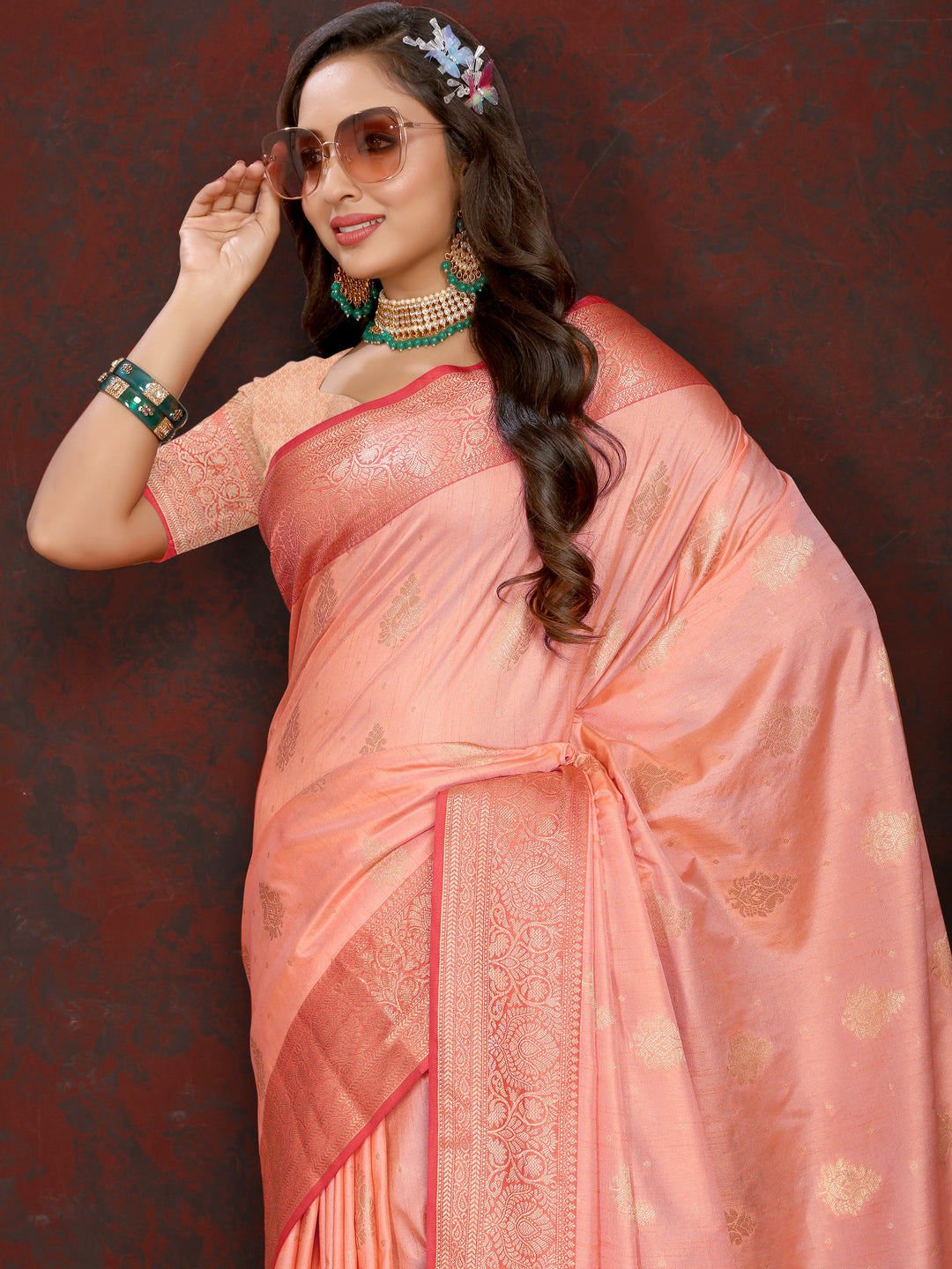 Stunning peach soft Katan silk saree with intricate zari detailing on the pallu, ideal for elegant gatherings.