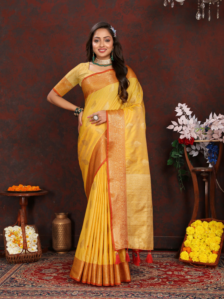 Elegant yellow Katan silk saree with graceful zari-adorned pallu, perfect for traditional celebrations and weddings.