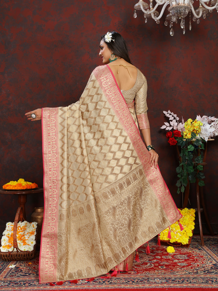 Traditional beige Katan silk saree with beautiful zari weaving, ideal for festive celebrations.