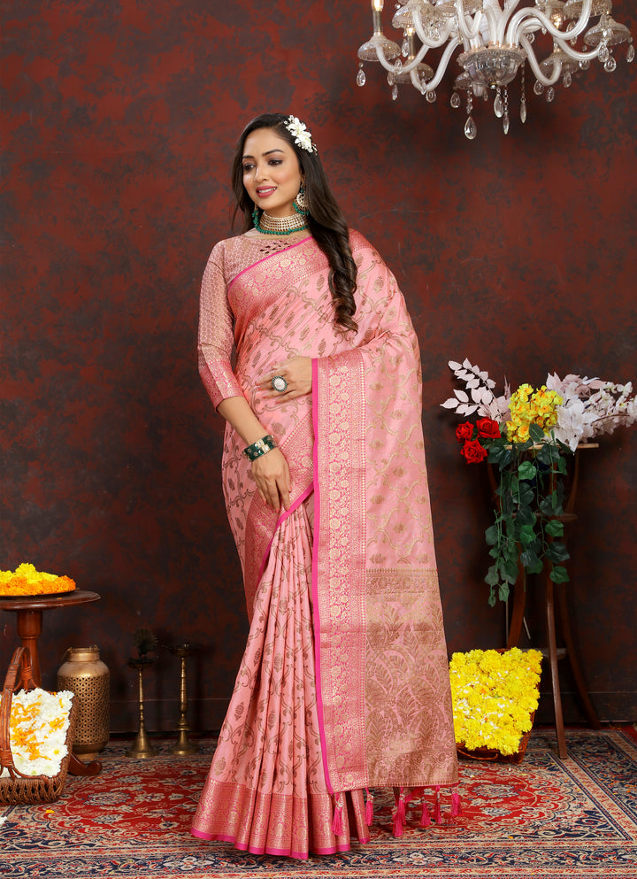 Elegant pink Katan silk saree with intricate zari weaving and tassels at the pallu, perfect for weddings.