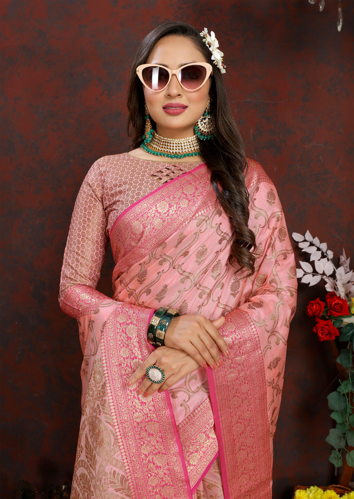 Traditional pink Katan silk saree with intricate zari work and matching blouse piece, designed for special occasions.