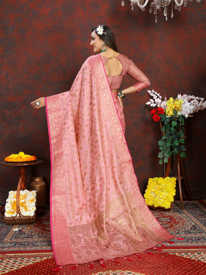 Exquisite pink Katan silk saree with zari border, tasseled pallu, and matching blouse, perfect for weddings.