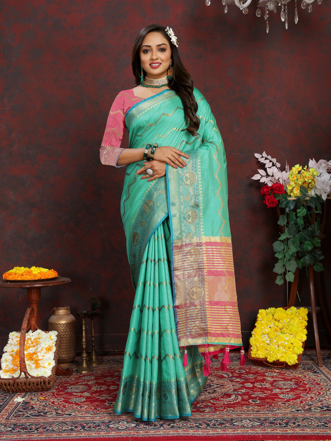 Elegant dark-sea-green silk saree with intricate zari work, perfect for weddings and formal occasions.