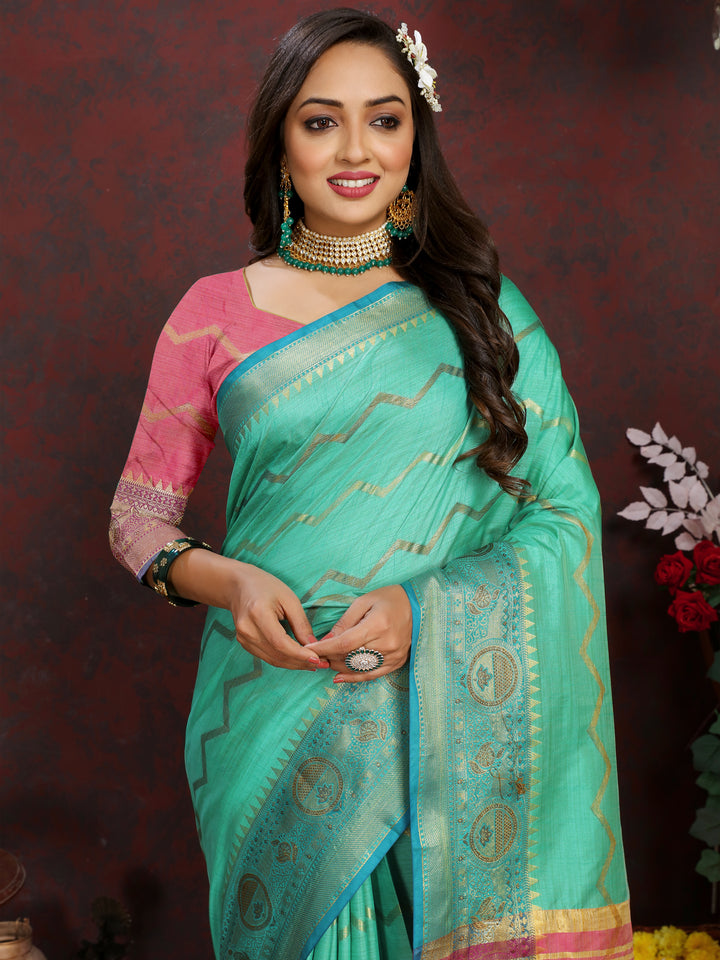 Timeless dark-sea-green Katan silk saree with luxurious zari weaving, ideal for grand events.