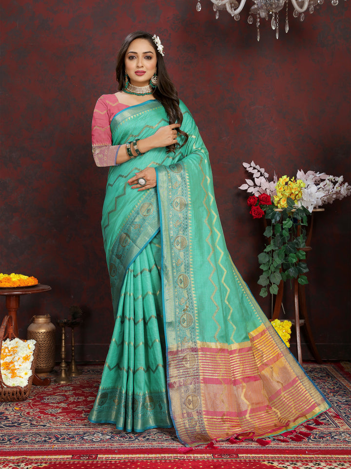 Designer dark-sea-green silk saree with exquisite zari work, perfect for festive celebrations.