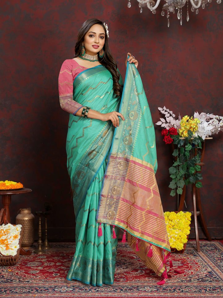 Dark-sea-green silk saree featuring beautiful zari weaving, perfect for cultural and traditional events.