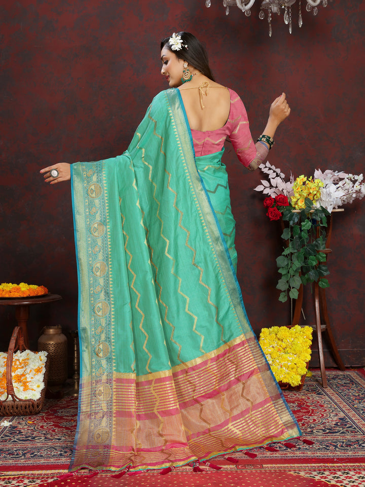 Traditional dark-sea-green Katan silk saree with intricate zari designs, ideal for formal celebrations.