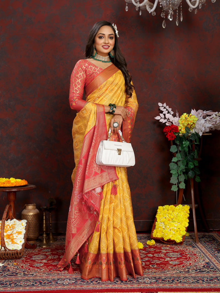 Designer yellow Meenakari Organza silk saree with rich zari detailing, perfect for weddings.