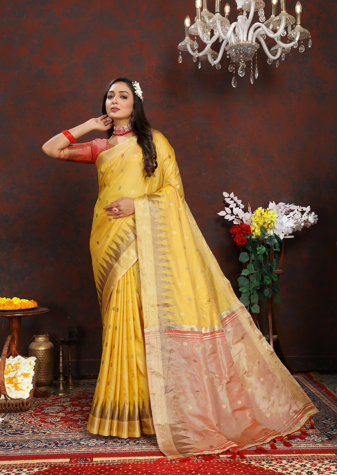 Elegant Yellow Silk Saree featuring intricate zari weaving and a designer pallu with tassels.