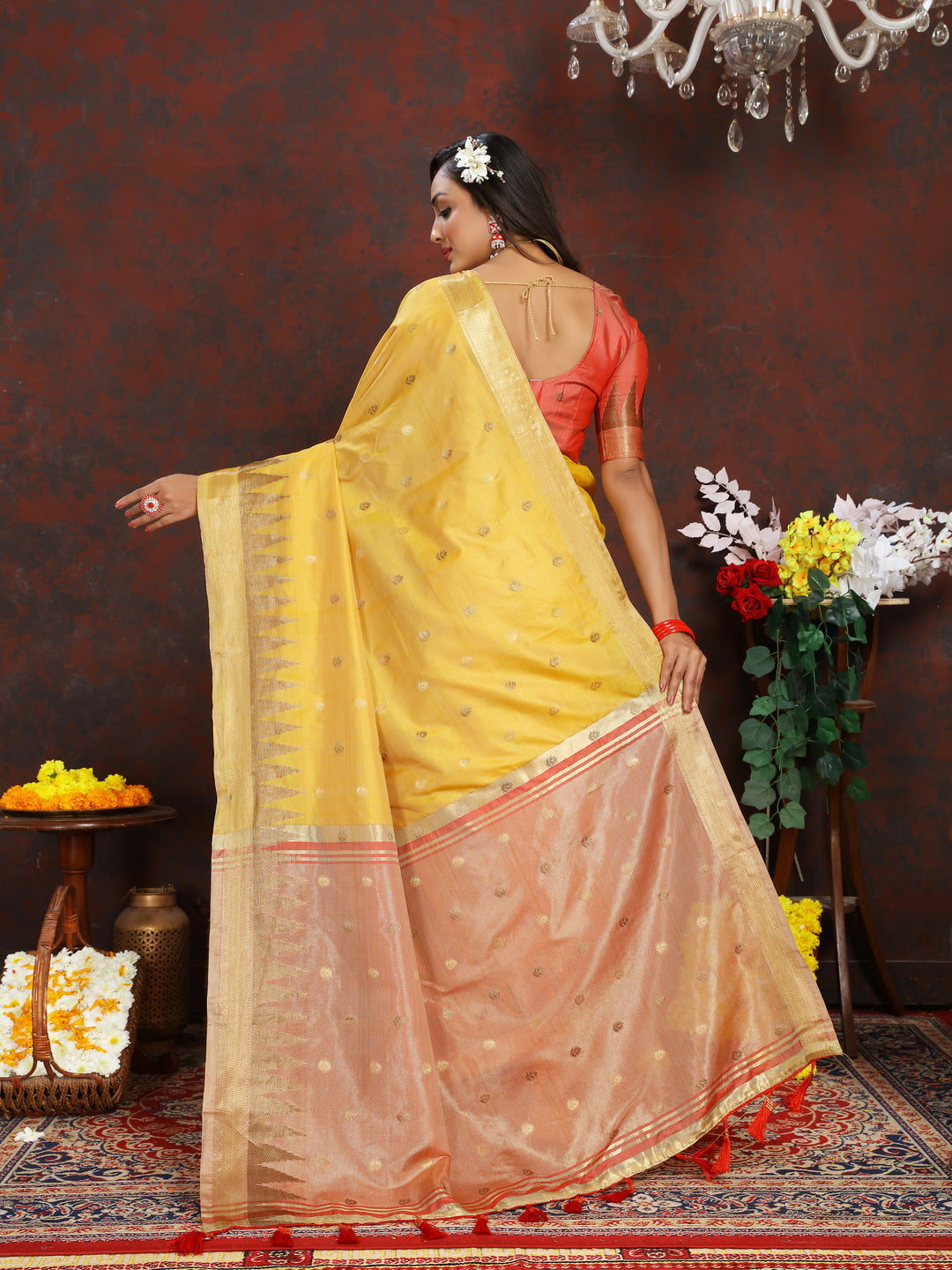 Premium Yellow Silk Saree with intricate zari weaving and a designer pallu with tassels for weddings.