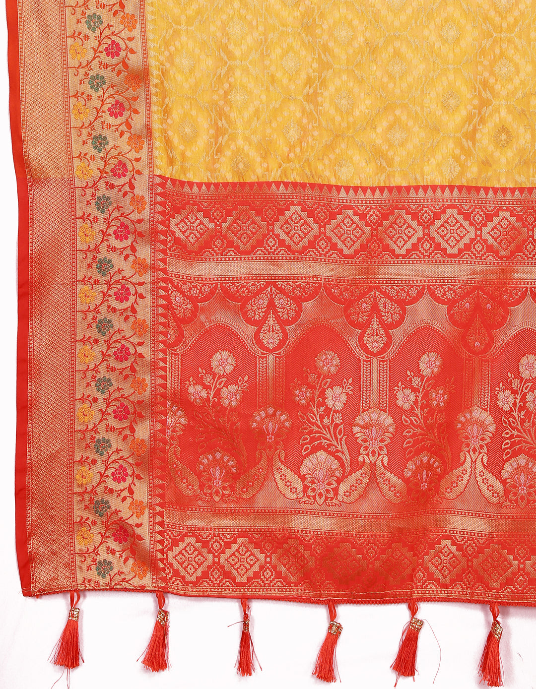 Traditional yellow Meenakari organza silk saree with a zari border and tassels at the pallu, perfect for weddings.