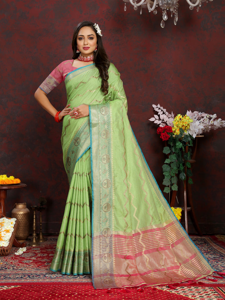 Designer light-green Katan silk saree with exquisite zari work, perfect for grand celebrations.