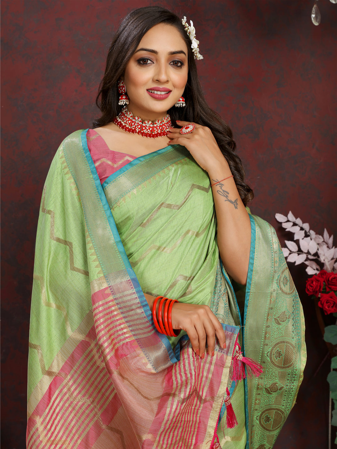 Light-green Katan silk saree with detailed zari weaving, perfect for formal occasions.