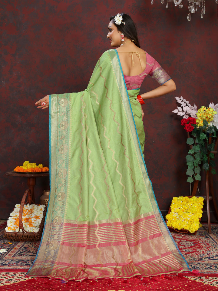 Elegant light-green silk saree with beautiful zari work, perfect for festive events.