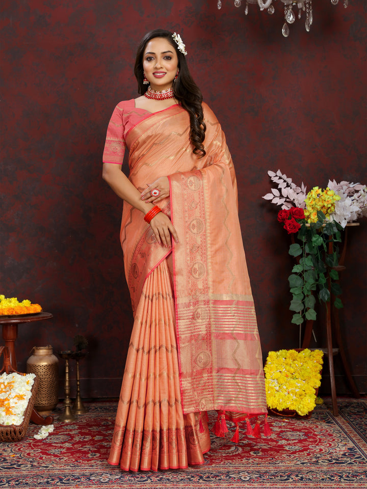 Elegant orange silk saree featuring detailed zari weaving, ideal for grand events.