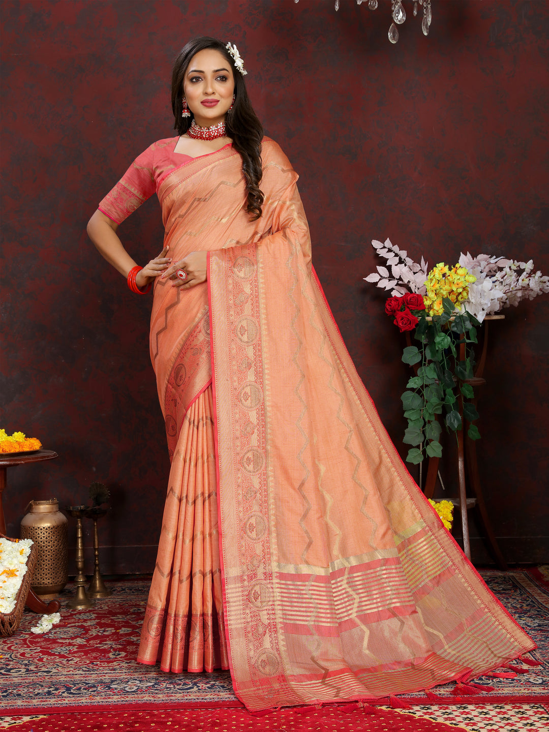 Timeless orange Katan silk saree with intricate zari work, perfect for formal and festive occasions.