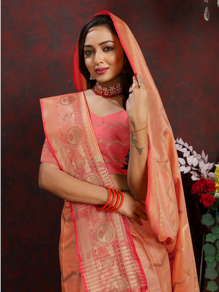 Orange silk saree with delicate zari weaving, perfect for weddings and special occasions.