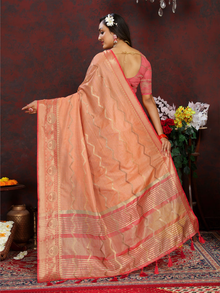 Luxurious orange Katan silk saree with intricate zari work, perfect for festive gatherings.