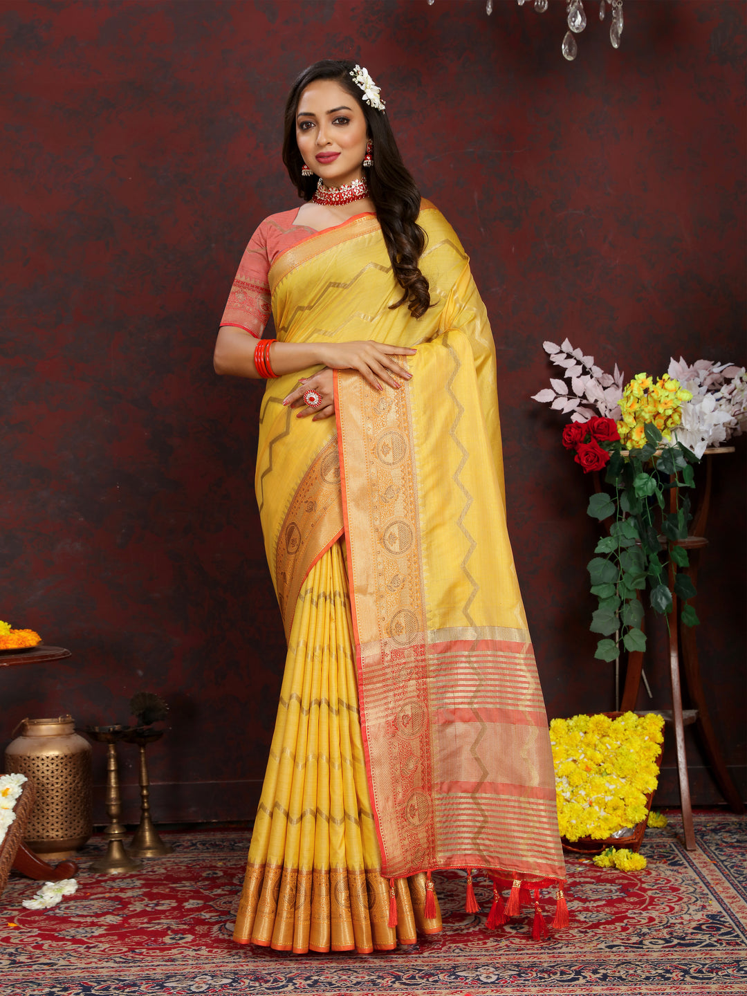 Timeless yellow Katan silk saree with detailed zari weaving, perfect for grand occasions.