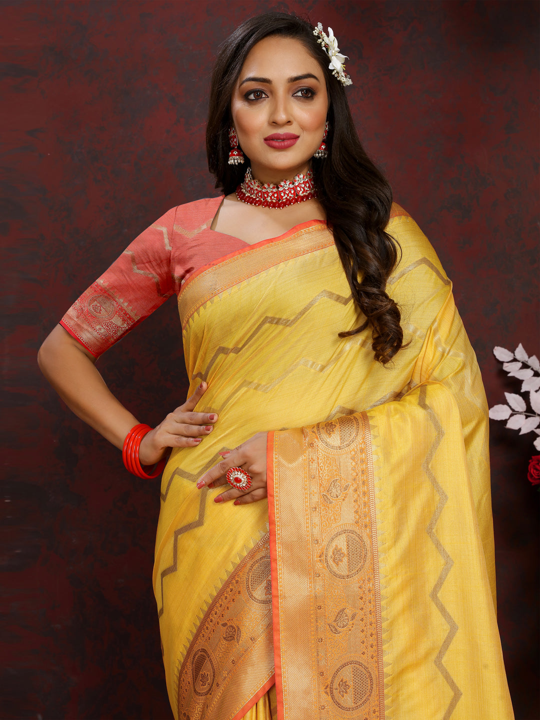 Designer yellow silk saree with exquisite zari work, ideal for formal celebrations.