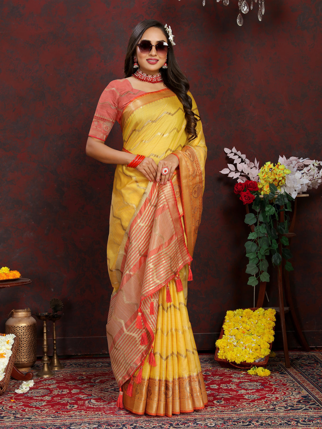 Luxurious yellow Katan silk saree with intricate zari designs, perfect for cultural gatherings.