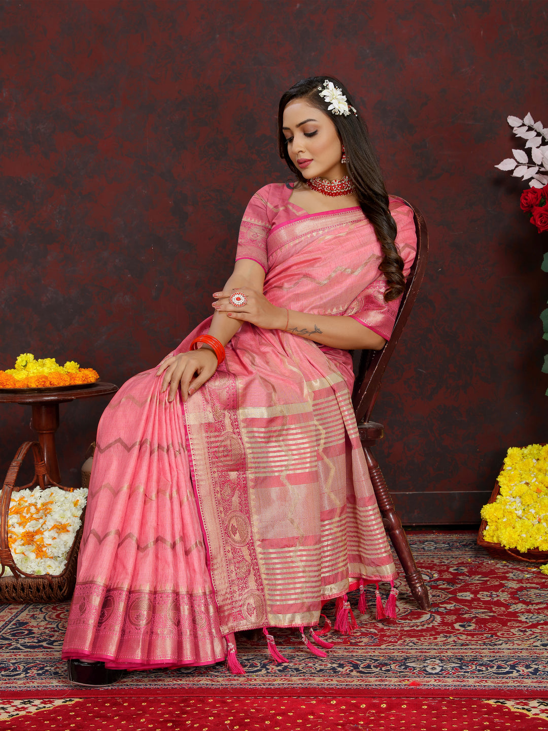 Luxurious pink Katan silk saree with beautiful zari weaving, ideal for weddings.