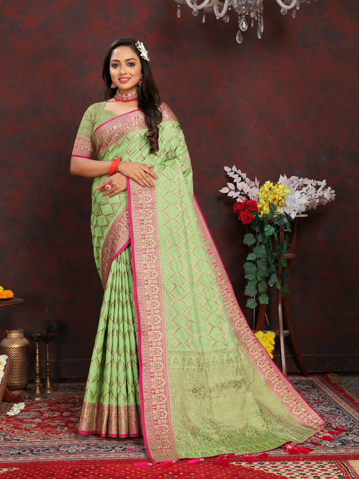 Timeless light-green silk saree with delicate zari weaving, perfect for grand occasions.