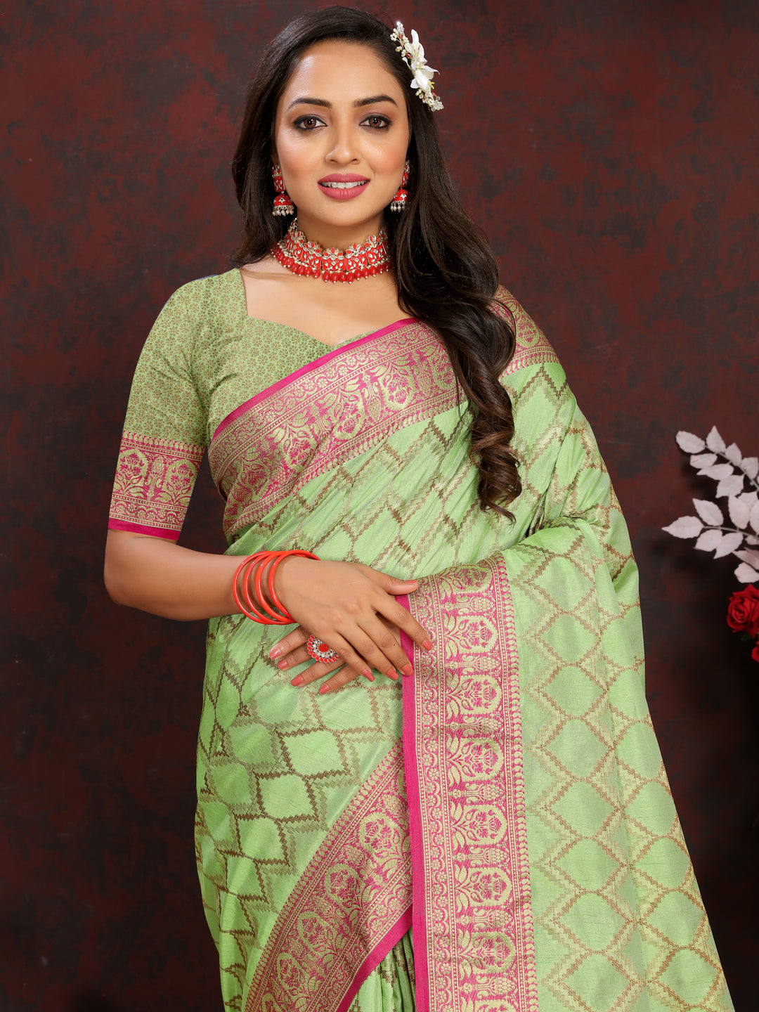 Elegant light-green Katan silk saree with intricate zari designs, perfect for cultural celebrations.