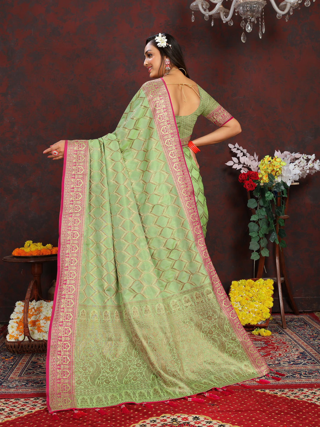 Traditional light-green Katan silk saree with luxurious zari weaving, perfect for festive occasions.