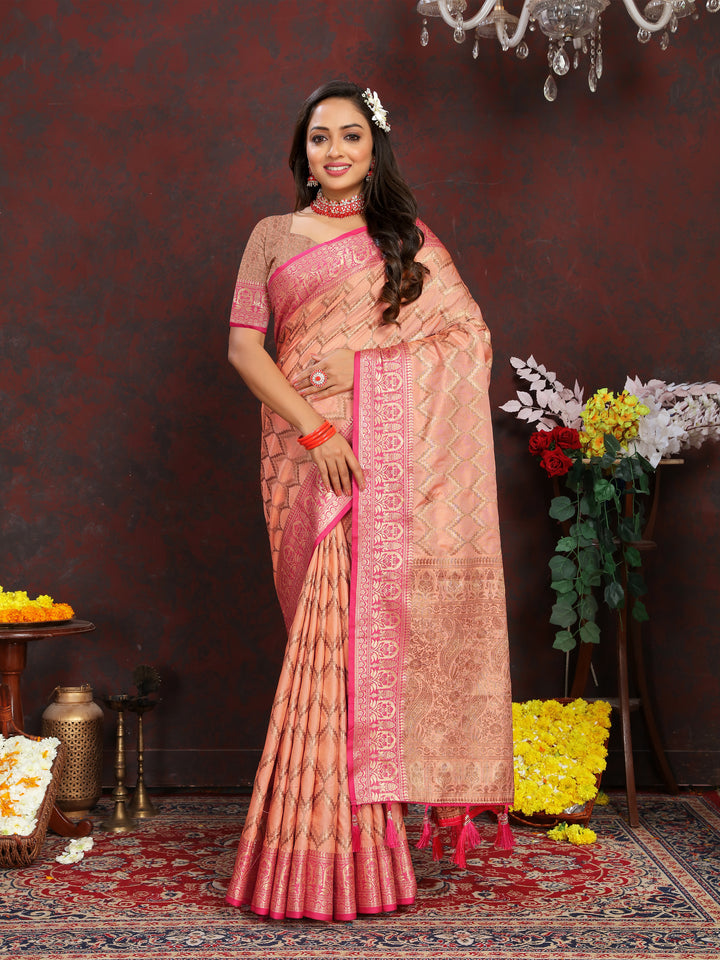 Elegant peach silk saree featuring exquisite zari weaving, perfect for grand events.