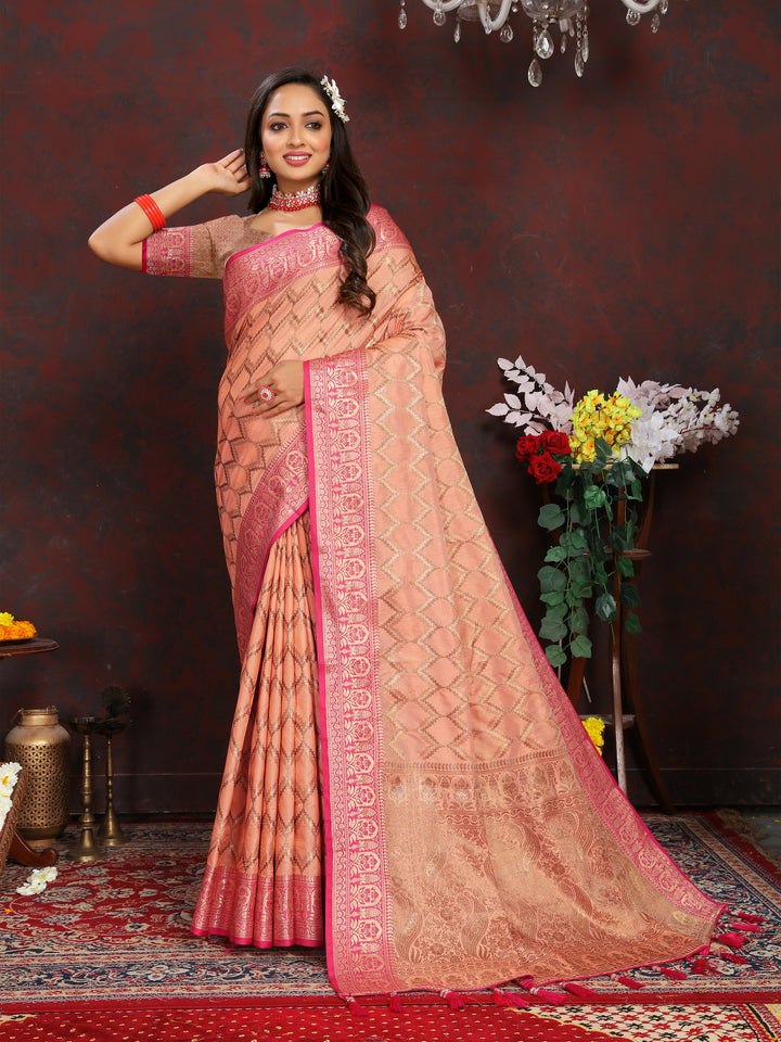 Timeless peach Katan silk saree with intricate zari work, ideal for traditional celebrations.