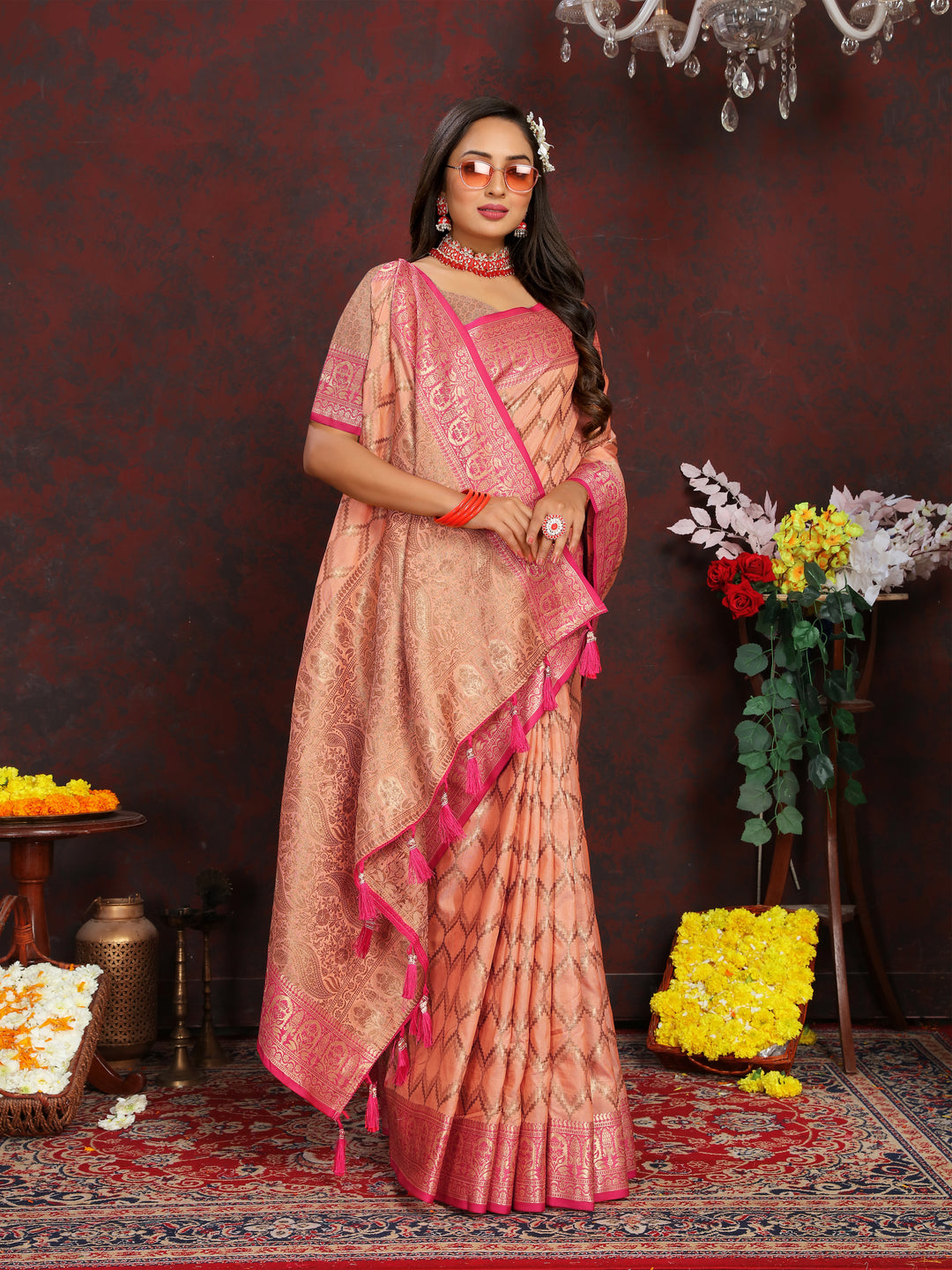 Luxurious peach Katan silk saree with delicate zari work, ideal for weddings and ceremonies.