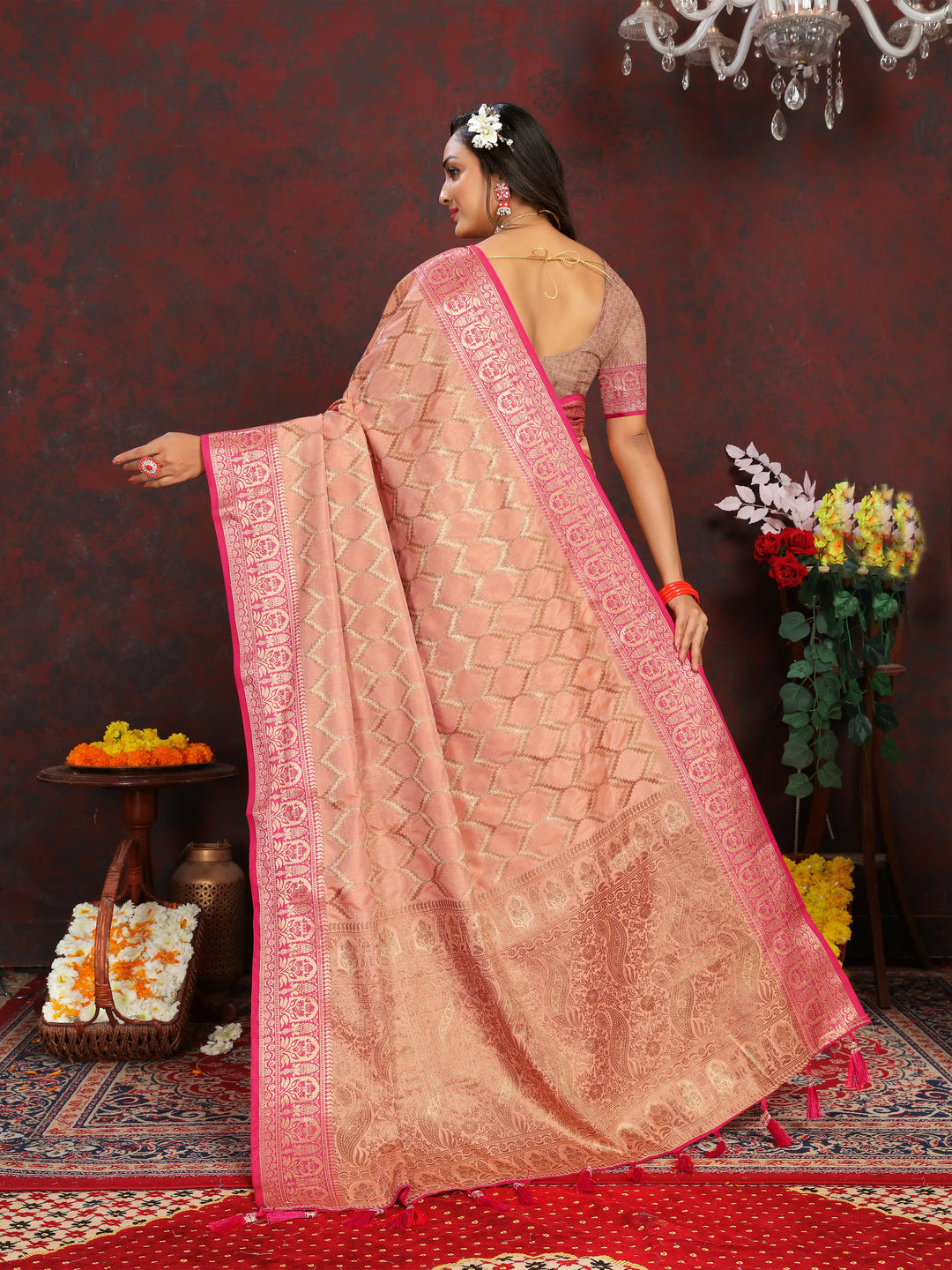 Traditional peach silk saree with beautiful zari weaving, perfect for formal events.