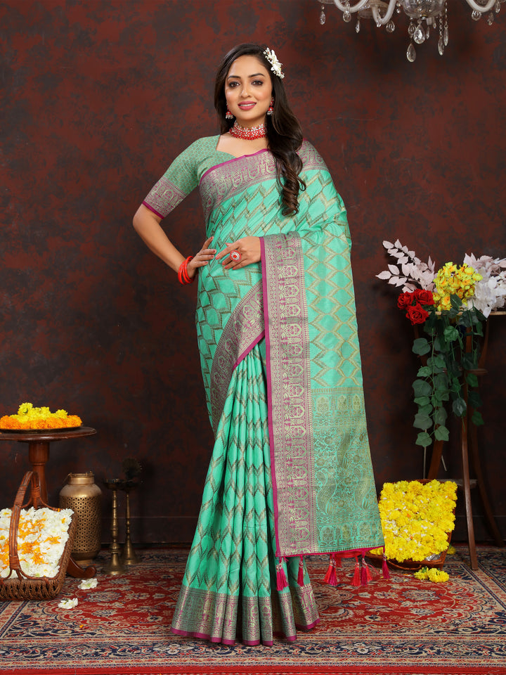 Timeless teal-green Katan silk saree with delicate zari designs, perfect for weddings.