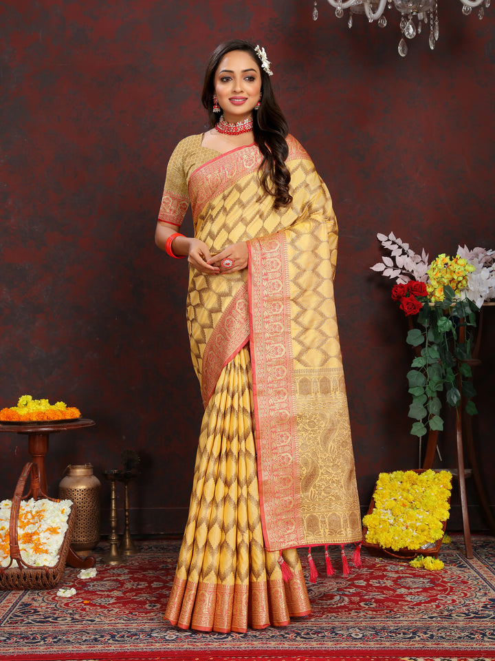 Designer yellow silk saree with intricate zari work, ideal for festive events.