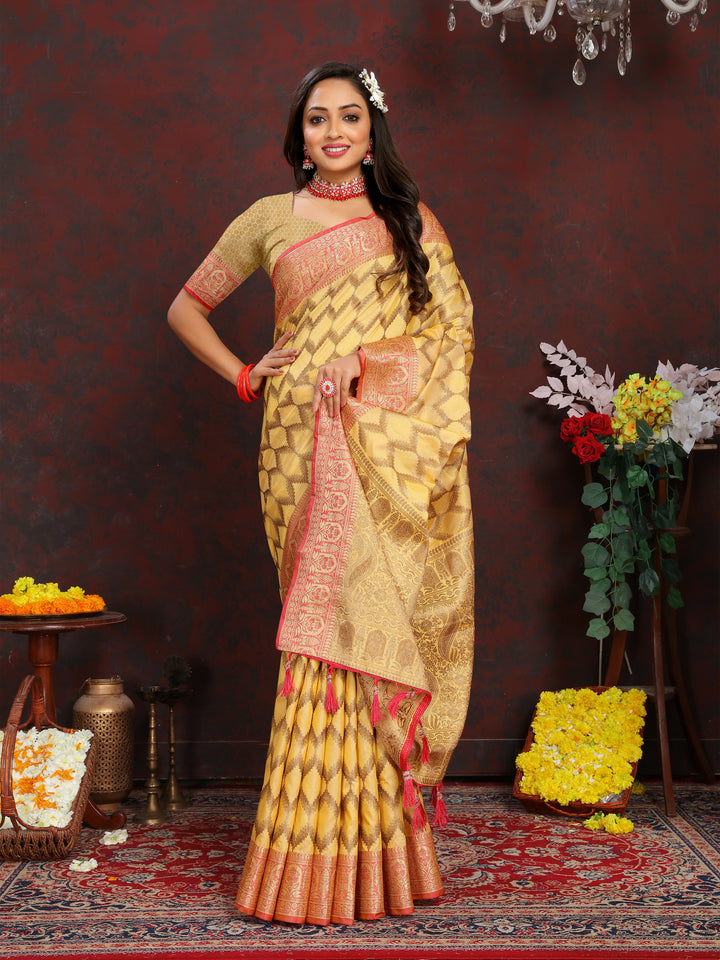 Luxurious yellow Katan silk saree with delicate zari weaving, perfect for weddings and ceremonies.