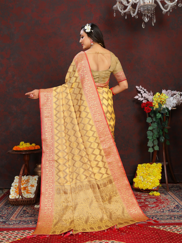 Elegant yellow silk saree featuring intricate zari work, ideal for grand events and weddings.