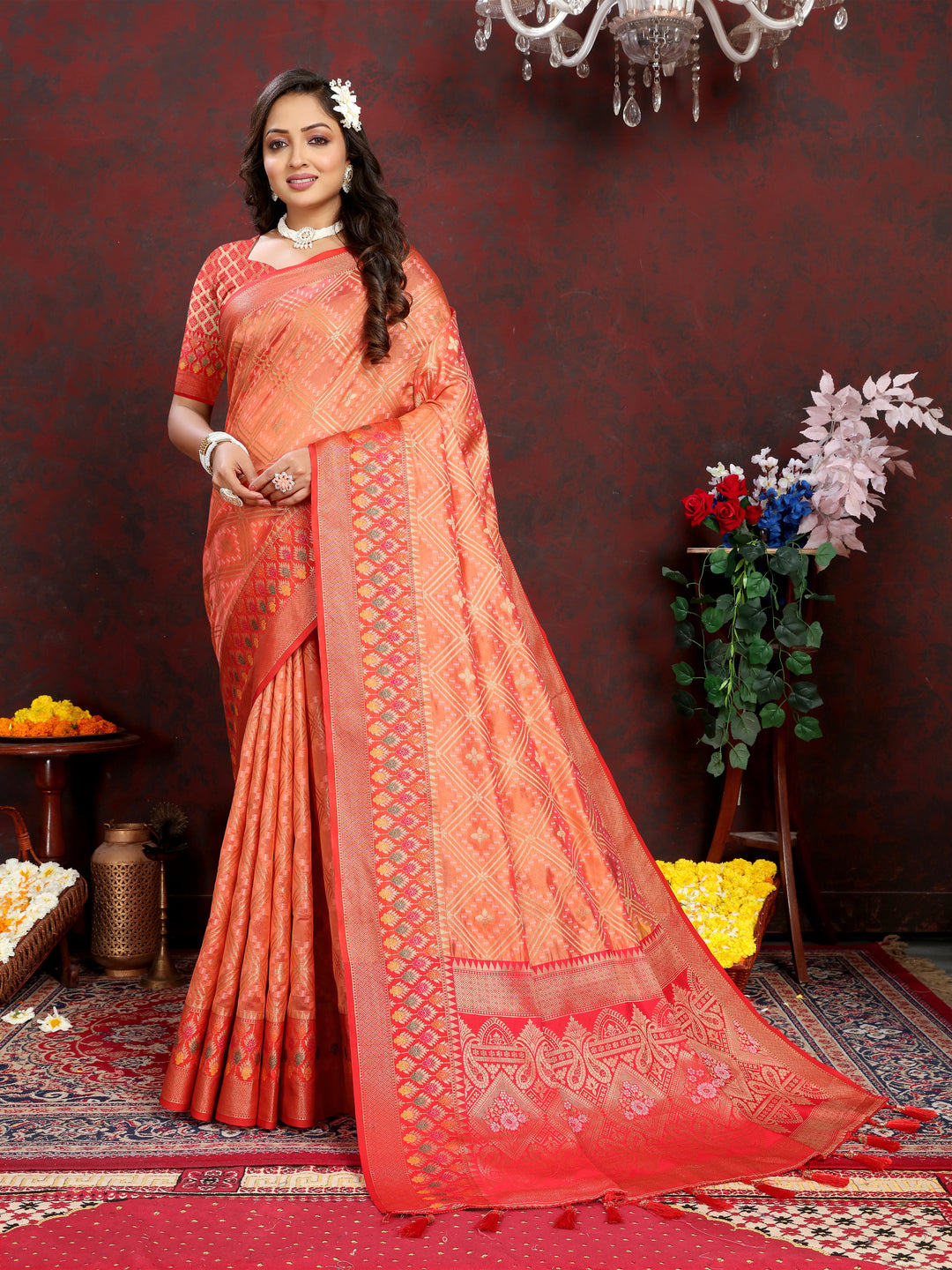 Orange Organza silk saree with luxurious zari and Meenakari pallu, ideal for grand celebrations.