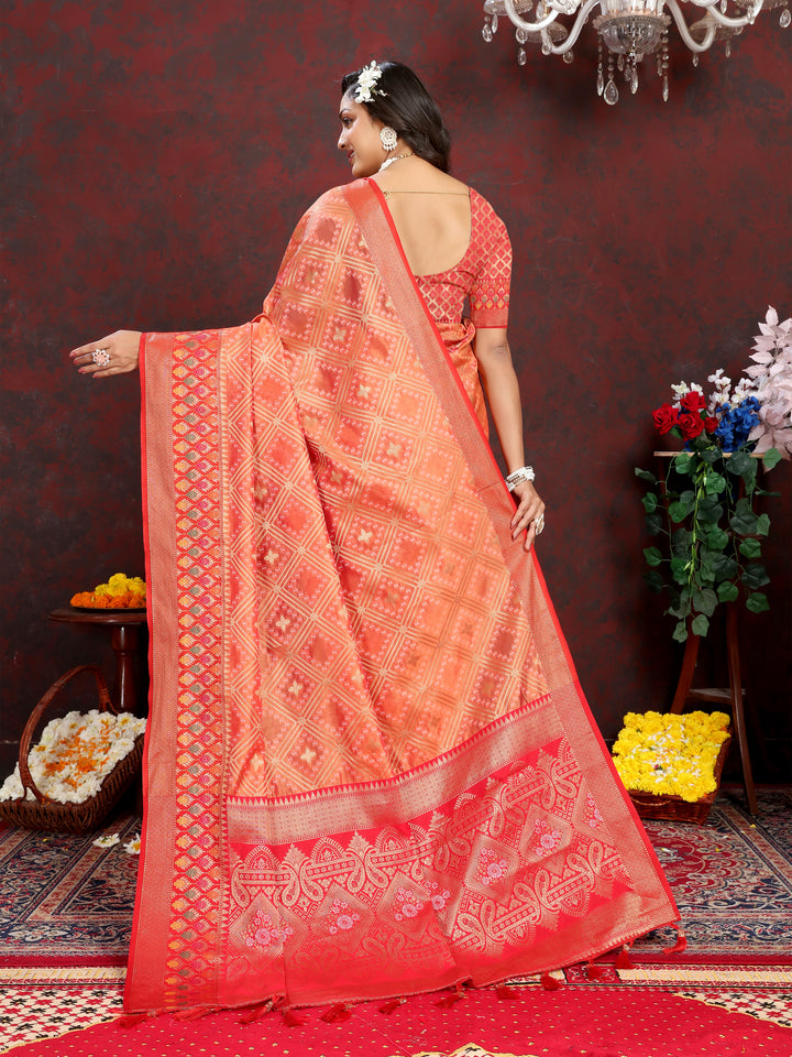 Orange Organza silk saree featuring intricate Meenakari pallu and zari weaving, perfect for Indian occasions.